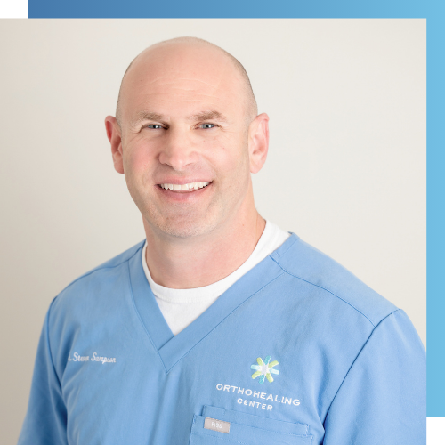 professional headshot of Dr. Steven Sampson in an embroidered blue shirt